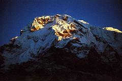 102 Annapurna South Sunrise From Chomrong The sun slowly started to rise, shining very brightly on Annapurna South, taken from Chomrong.